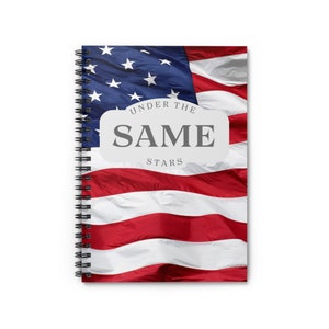 May include: A spiral bound notebook with a red, white, and blue American flag design. The text "Under the Same Stars" is printed on the cover.