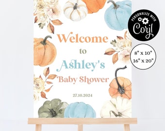 Puede incluir: Un letrero de bienvenida para baby shower sobre un caballete de madera. El letrero presenta calabazas de acuarela en naranja, azul y blanco, con detalles florales. El texto dice "Welcome to Ashley's Baby Shower" y la fecha. Disponible en 20 cm x 25 cm y 40 cm x 50 cm.