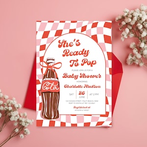 May include: Baby shower invitation with a retro design. The invitation features a Coca-Cola bottle illustration and the text "She's Ready To Pop." The background has a red and pink checkered pattern. The invitation is for Charlotte Hudson.