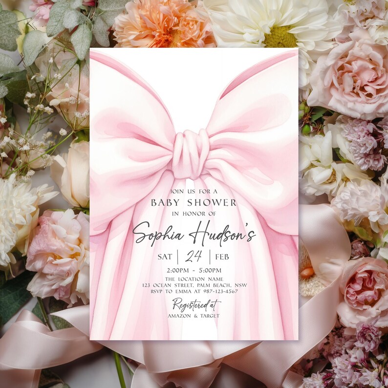 May include: A baby shower invitation featuring a large pink bow design. The invitation includes the text "Join us for a Baby Shower in Honor of Sophia Hudson's" with event details. The invitation is surrounded by floral arrangements.