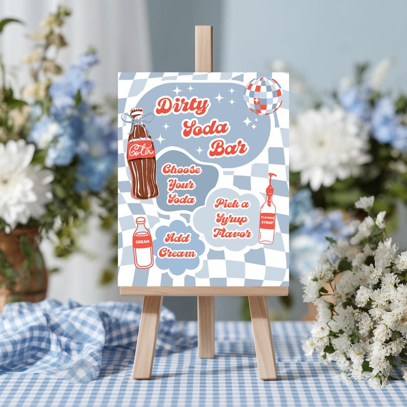 May include: A wooden easel displays a sign with the text "Dirty Soda Bar." The sign features illustrations of a soda bottle, cream, and syrup, with a blue and white checkered background. The sign is decorated with a disco ball.