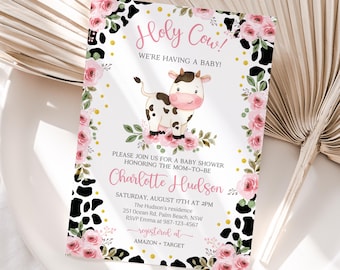 May include: A baby shower invitation with a black and white cow print background. Pink flowers and gold dots decorate the border. The text reads "Holy Cow! We're having a baby!" and "Charlotte Hudson".