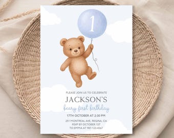 May include: A light blue invitation card featuring a watercolor illustration of a brown teddy bear holding a blue balloon with the number 1. The card includes the text "JACKSON'S beary first birthday" and event details.
