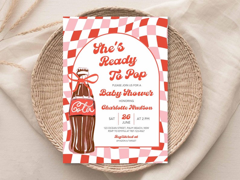 May include: Baby shower invitation with a retro design. The invitation features a red and pink checkered background and a cola bottle illustration. Text includes "She's Ready To Pop" and event details.