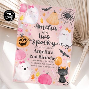 May include: A pink Halloween-themed birthday invitation with the text "Amelia is a two spookyne". The invitation features illustrations of ghosts, pumpkins, bats, and a black cat. The invitation also includes the date, time, and location of the party.