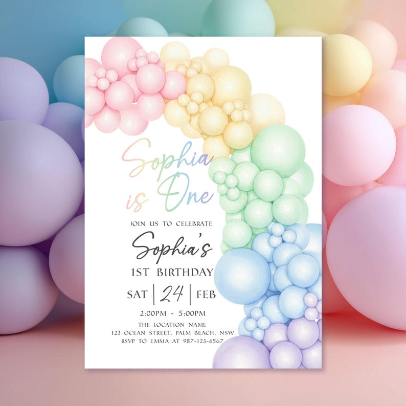 May include: A white invitation card with a rainbow balloon arch design. The text reads "Sophia is One" and details for a first birthday celebration, including the date, time, and location.
