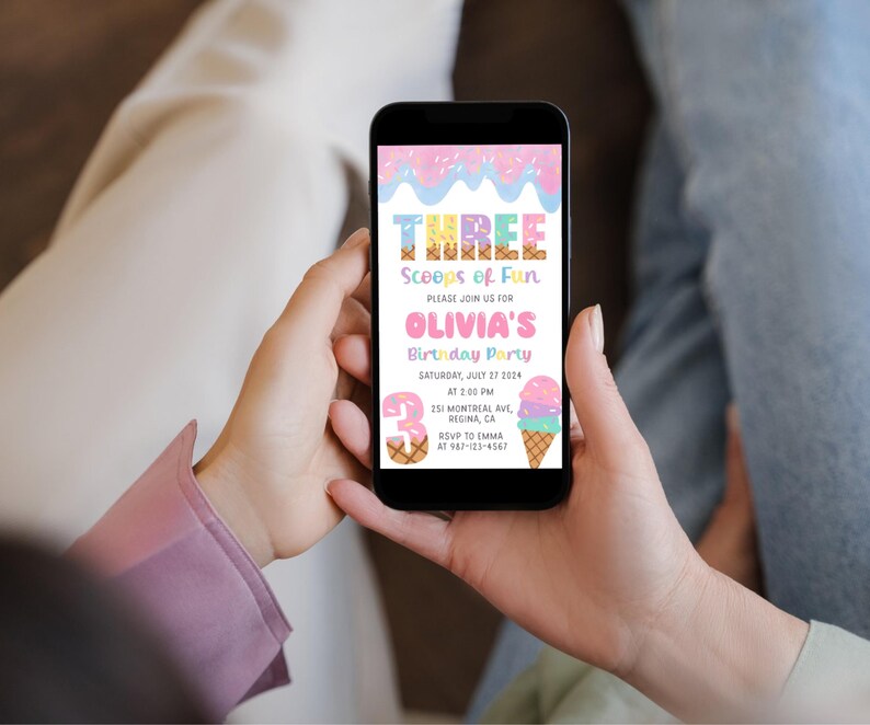 May include: A smartphone displays a colorful birthday party invitation. The invitation reads "THREE Scoops of Fun" and "OLIVIA'S Birthday Party". The design includes ice cream cones and sprinkles in pastel colors. The date is Saturday, July 27, 2024.