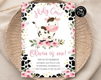 May include: A pink and white cow with black spots is on a white background with pink flowers and a black and white cow print pattern. The text "Holy Cow!" is in pink letters and the text "Olivia is one!" is in pink letters. The text "Join us to celebrate Saturday, Aug 6th at 2 PM 251 Montreal Ave, Regina, CA RSVP to Emma at 987-123-4567" is in black letters.