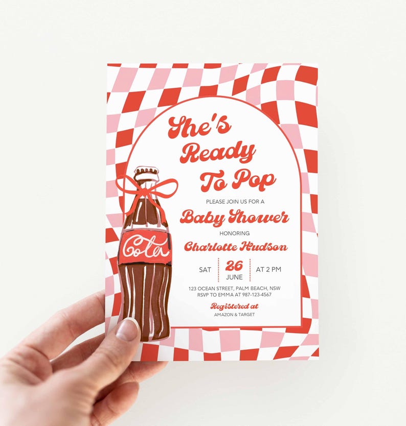 May include: Baby shower invitation with a red and pink checkered background. The invitation features a brown cola bottle illustration with a red ribbon. Text reads "She's Ready To Pop" and details for the event.