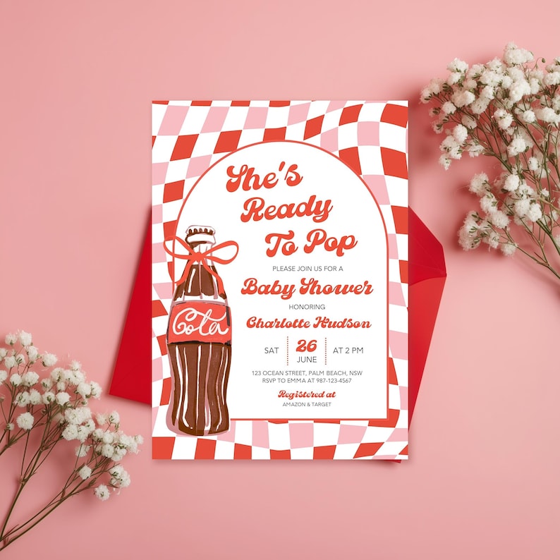 May include: Baby shower invitation with a retro design. The invitation features a Coca-Cola bottle illustration and the text "She's Ready To Pop." The background has a red and pink checkered pattern. The invitation is for Charlotte Hudson.