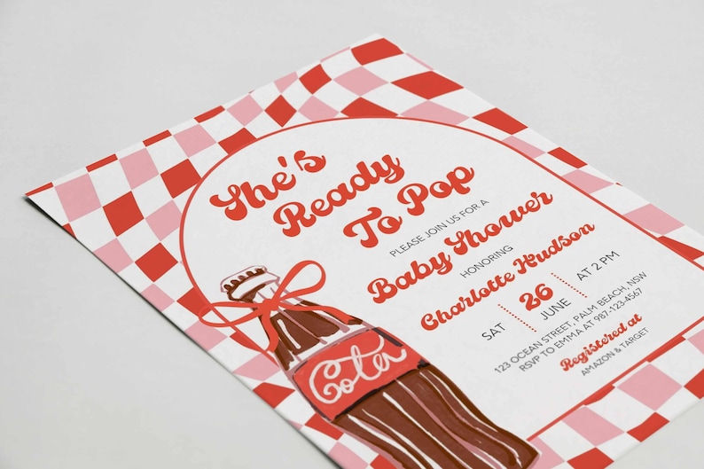 May include: Baby shower invitation with a retro design. The invitation features a red and pink checkered pattern and a cartoon cola bottle illustration. Text includes "She's Ready To Pop" and event details.