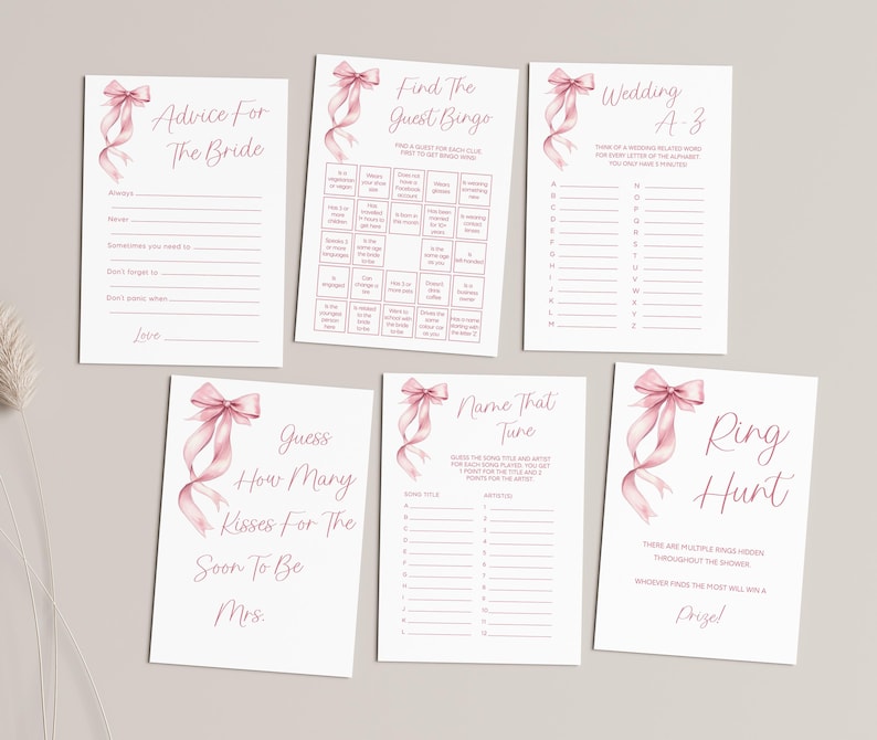 Puede incluir: Un conjunto de juegos de despedida de soltera imprimibles con ilustraciones de cintas rosas. Los juegos incluyen "Consejos para la novia", "Encuentra el bingo de los invitados", "Boda A-Z", "Adivina cu&aacute;ntos besos para la futura Sra.", "Nombra esa melod&iacute;a" y "B&uacute;squeda del anillo".