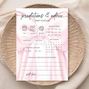 May include: A pink baby shower game card with the text "predictions & advice" and "Baby Hudson". The card includes sections for time, weight, length, hair color, eye color, and baby's appearance. It also has a section for advice and wishes.