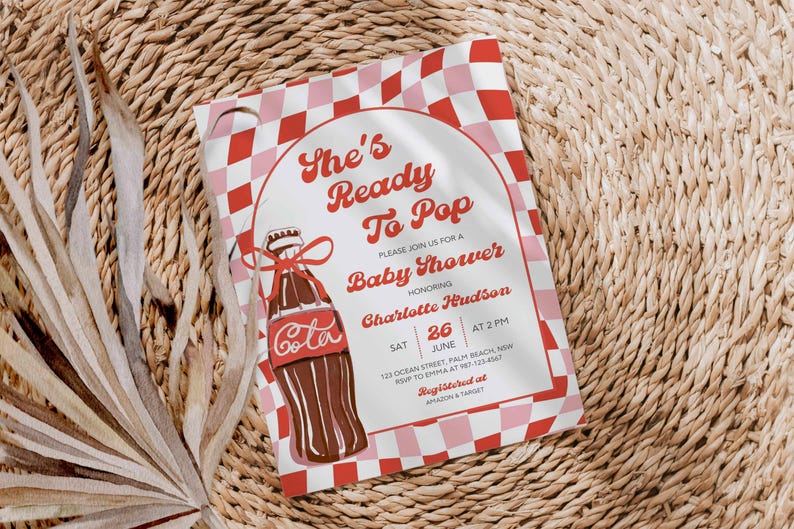 May include: Baby shower invitation with a retro design. The invitation features a red and pink checkered pattern and a vintage illustration of a cola bottle. Text includes "She's Ready To Pop" and event details.