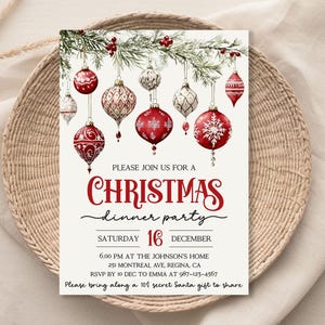 May include: A Christmas dinner party invitation with a red and white watercolor design of ornaments hanging from a pine branch. The text reads "Please join us for a Christmas dinner party, Saturday 16 December, 6:00 PM at the Johnson's Home, 251 Montreal Ave, Regina, CA, RSVP by 10 Dec to Emma at 987-123-4567, Please bring along a 10$ secret Santa gift to share."