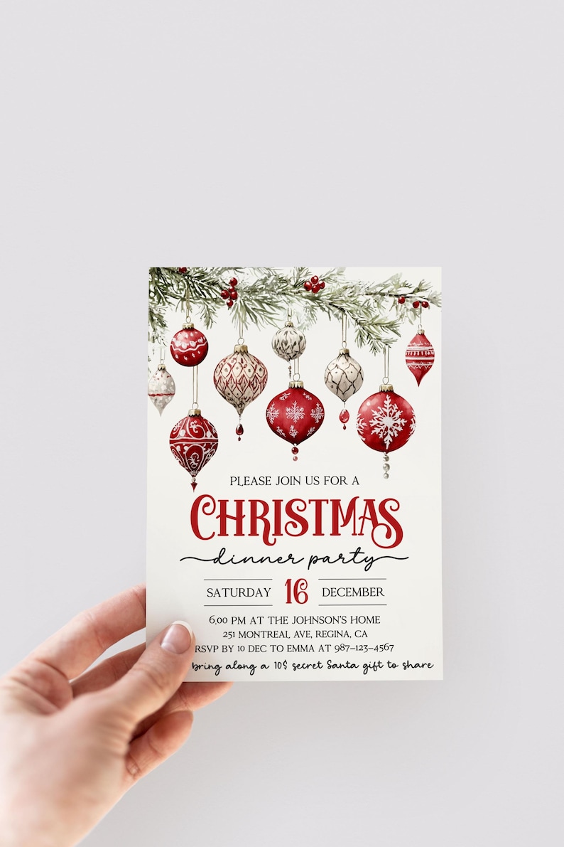 May include: A Christmas dinner party invitation with a red and white color scheme. The invitation features a festive illustration of red and white ornaments hanging from a pine branch. The text reads "Please join us for a Christmas dinner party Saturday 16 December 6:00 PM at the Johnson's Home 251 Montreal Ave, Regina, CA RSVP by 10 Dec to Emma at 987-123-4567 bring along a 10$ secret Santa gift to share".