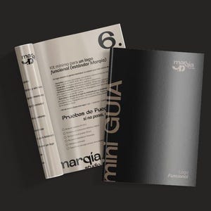 May include: A top-down view of a black and white brochure and a black booklet. The brochure is open, revealing text and the number 6. The booklet has the words "mini GUIA" printed vertically. The logo "narqia studio" is visible.