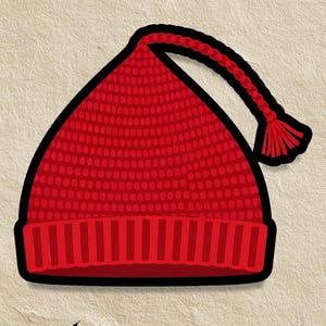 Peut inclure: Un bonnet rouge tricoté avec un contour noir et un gland tressé. Le bonnet a un bord côtelé et un corps texturé. Les mots "Artfully Imagined" sont au bas de l'image.