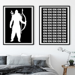 May include: Two black and white framed prints. The print on the left features a silhouette of a person holding a bow and arrow. The print on the right features the word "Ram" repeated 15 times in a vertical column.
