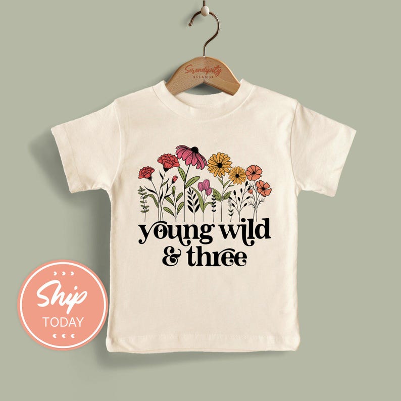 a t - shirt that says young wild and three
