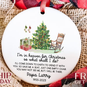 a christmas ornament with a picture of a rocking chair and a christmas tree