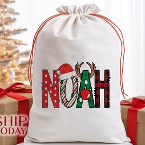 a bag with the word noah on it next to a christmas tree