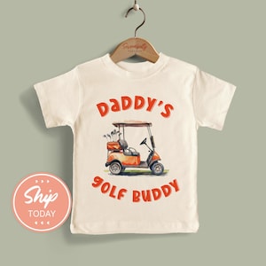 Koszulka dla malucha Daddy's Golf Buddy, prezent na Dzień Ojca dla dzieci, słodka koszulka dla malucha z wózkiem golfowym, strój na 4 lipca dla dzieci (KA-DAD21)