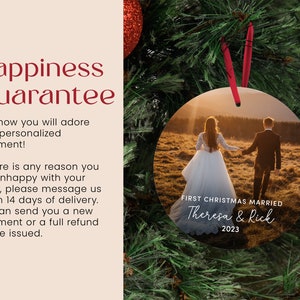 a christmas ornament with a picture of a couple holding hands