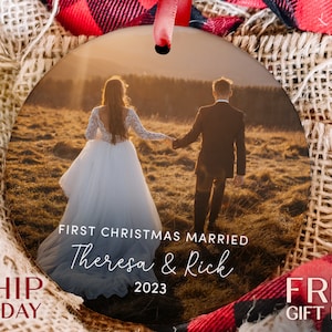 a christmas ornament with a picture of a couple holding hands