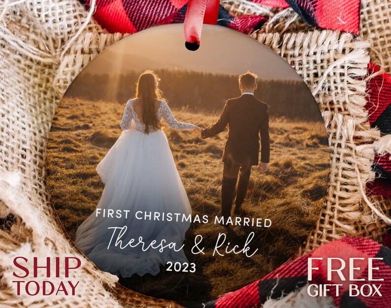 a christmas ornament with a picture of a couple holding hands