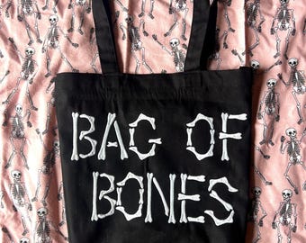 Embroidered “Bag of Bones” black canvas tote bag. Glow in the dark thread.