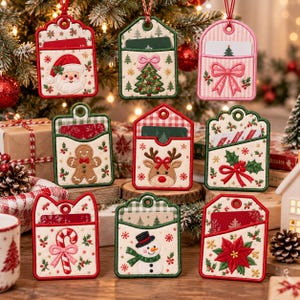 May include: A collection of nine embroidered fabric gift card holders featuring festive holiday designs including Santa Claus, a gingerbread man, a reindeer, a snowman, a Christmas tree, a candy cane, and a poinsettia.