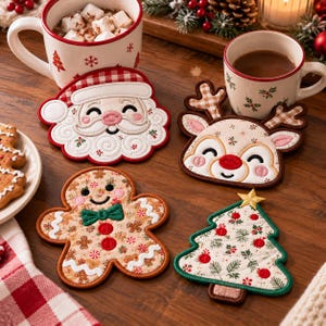 May include: A set of four fabric coasters featuring embroidered Christmas designs: a Santa Claus face, a reindeer with plaid antlers, a gingerbread person with a green bow tie, and a decorated Christmas tree with a gold star.