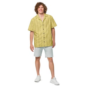 Full-body view of a model wearing the yellow Backrooms Level 0 wallpaper shirt with shorts