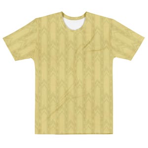 May include: A short-sleeved t-shirt in a pale yellow hue featuring a repeating vertical pattern of darker yellow chevron arrows and thin stripes. The garment has a standard crew neckline and a consistent all-over print design on the front.