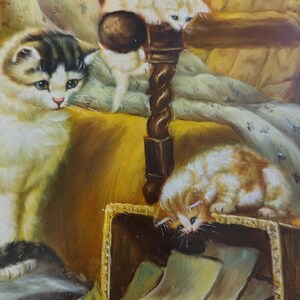 May include: A painting of three kittens in a cozy setting. One kitten is white and perched on a wooden post, another is black and white and lying down, and the third is orange and white and looking into a box.