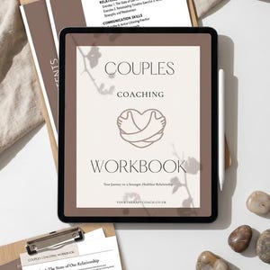 May include: A digital couples coaching workbook on a tablet, with the text "Couples Coaching Workbook". The image includes a pen, clipboard with worksheets, a mug, and decorative stones. The text "Instant Digital Download" is also visible.