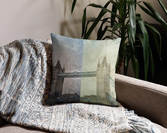 May include: A throw pillow with a vintage-style image of Tower Bridge in London. The pillow features a faded, textured background with a light blue and green color scheme.