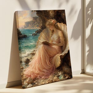 May include: A rectangular canvas print depicting a person with long blonde hair adorned with flowers, wearing a flowing pale pink gown, sitting inside a large seashell on a rocky beach. The scene includes a turquoise ocean, cliffs, and a sunset.