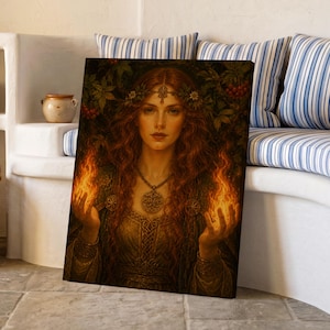 May include: A rectangular canvas print featuring a portrait of a person with long red hair, wearing a floral crown and a detailed necklace, holding flames in both hands. The artwork is set against a dark background with green leaves and red berries.