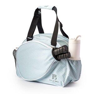 Stylish womens pickleball bag trendy paddle tote sleek design elegant gear bag compact lightweight adjustable strap travel ready durable yet fashionable chic pickleball storage feminine style vibrant colors tournament ready high quality versatile bag