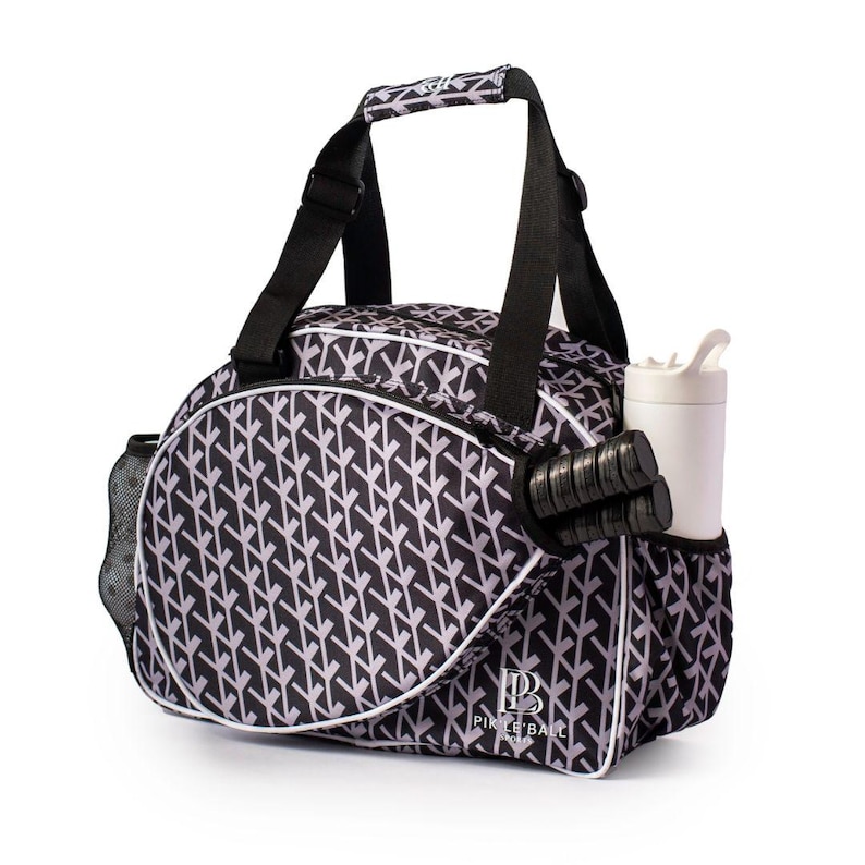 Stylish womens pickleball bag trendy paddle tote sleek design elegant gear bag compact lightweight adjustable strap travel ready durable yet fashionable chic pickleball storage feminine style vibrant colors tournament ready high quality versatile bag