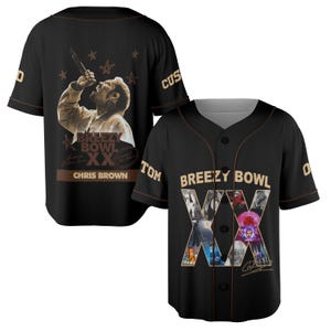 May include: Black baseball jersey with brown trim. The jersey has a sepia-toned image of a singer on the back, with the text "Breezy Bowl XX" and "Chris Brown". The front displays the text "Breezy Bowl XX" and a collage of images.