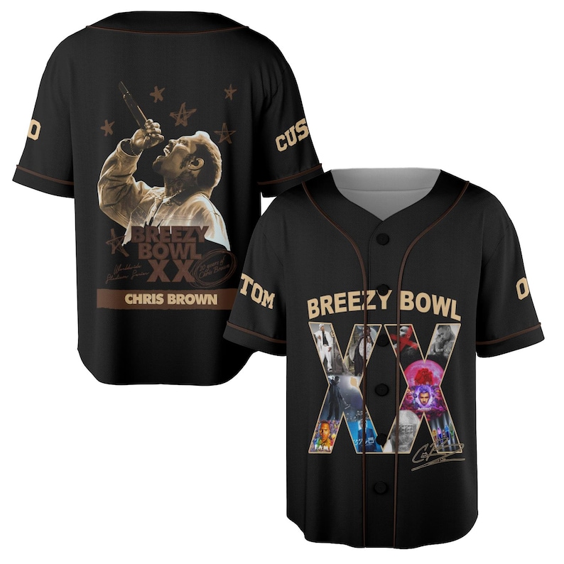 May include: Black baseball jersey with brown trim. The jersey has a sepia-toned image of a singer on the back, with the text "Breezy Bowl XX" and "Chris Brown". The front displays the text "Breezy Bowl XX" and a collage of images.