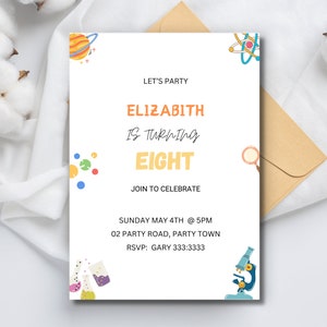 May include: A white invitation card with science-themed illustrations, including a planet, atom, and microscope. The text reads "ELIZABITH IS TURNING EIGHT" and includes party details. The card is accompanied by a beige envelope and cotton accents.