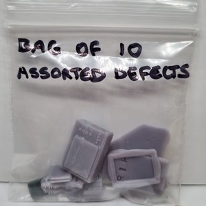 Two bags of 10- 1/48th assorted miniature defects-total 20 items