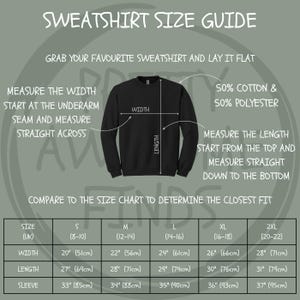 May include: A black sweatshirt size guide with text instructions on how to measure the width, length, and sleeve. The guide includes a size chart with measurements in inches and centimeters for sizes S to 2XL. The sweatshirt is made of 50% cotton and 50% polyester.