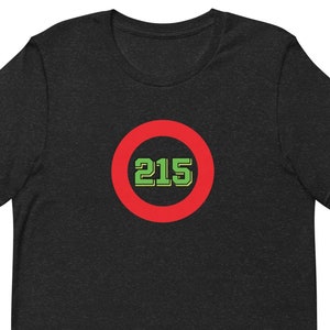 May include: Black t-shirt with a red circle and the number 215 in green.