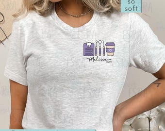 May include: A light gray t-shirt with a small graphic of dental tools, a coffee cup, and the name "Melissa RDH" in purple. The shirt also has the text "Forever ESRA so soft" and "more colors options".