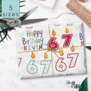 May include: A birthday gift wrapped in white paper with colourful confetti and the numbers 67 with flames. The words "Happy Birthday KEVIN" are printed on the paper. The gift is tied with twine, and scissors and a tag are nearby.